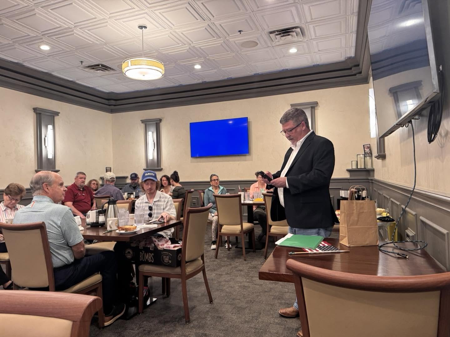 A member presenting at an Alamo Business Club meeting