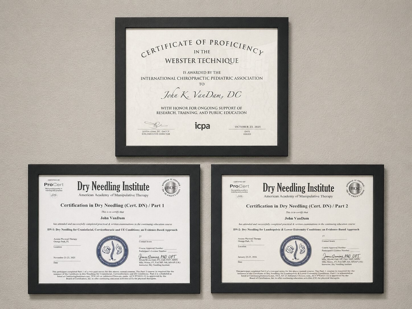 Three framed certificates on the wall at Bandera Chiropractic: the ICPA Certificate of Proficiency in the Webster Technique awarded to John K. VanDam, DC, and Dry Needling Institute certifications in Dry Needling Parts 1 and 2 from the American Academy of Manipulative Therapy