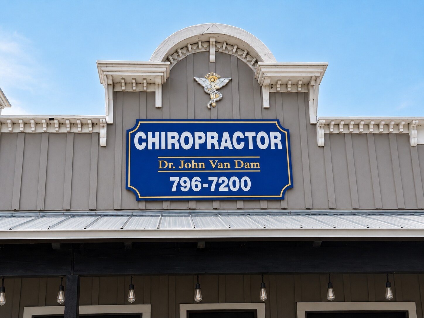 The Bandera Chiropractic storefront sign on Highway 16, reading Chiropractor, Dr. John Van Dam, 796-7200