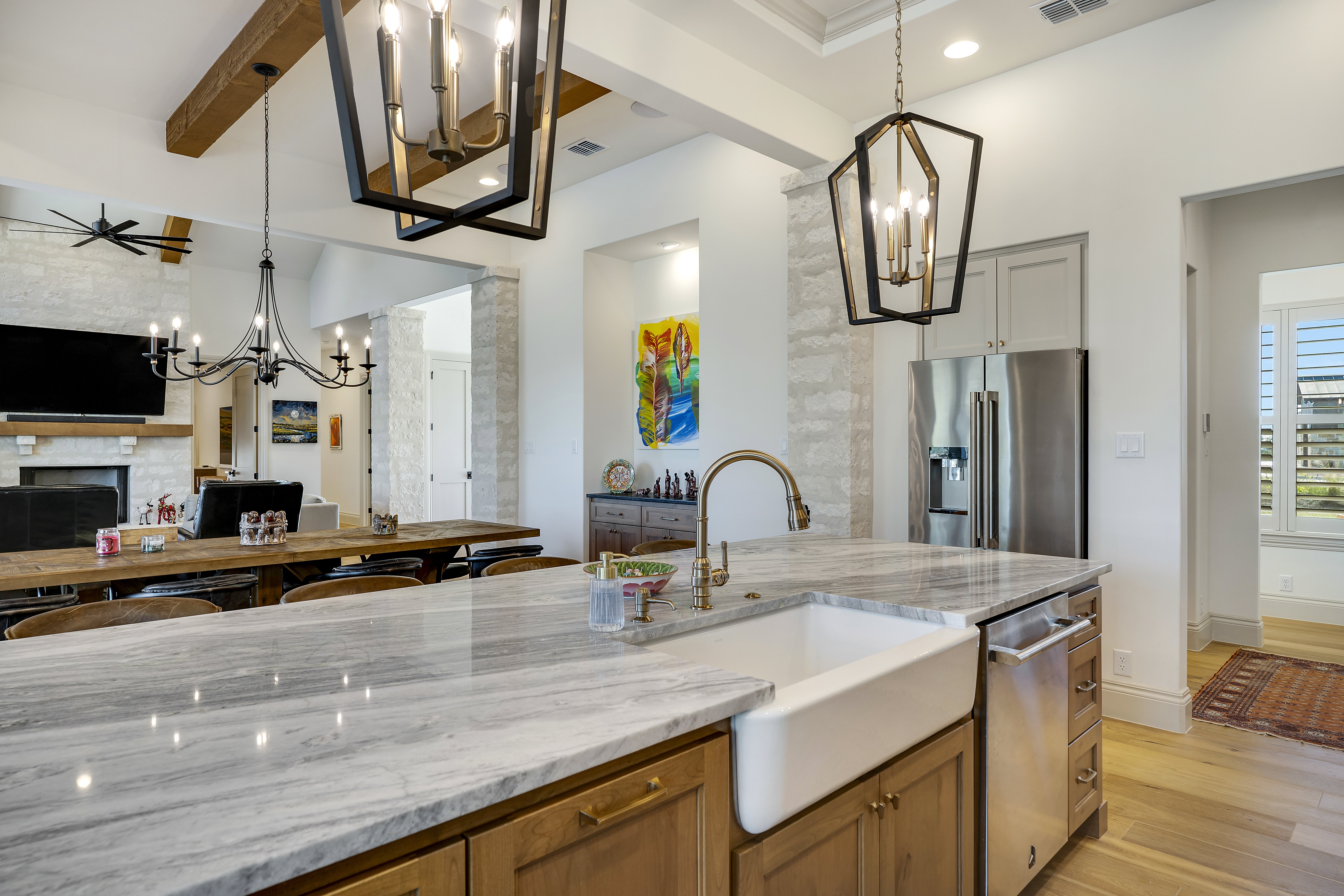 Whole-home remodel by Marquis Builders, kitchen and great room