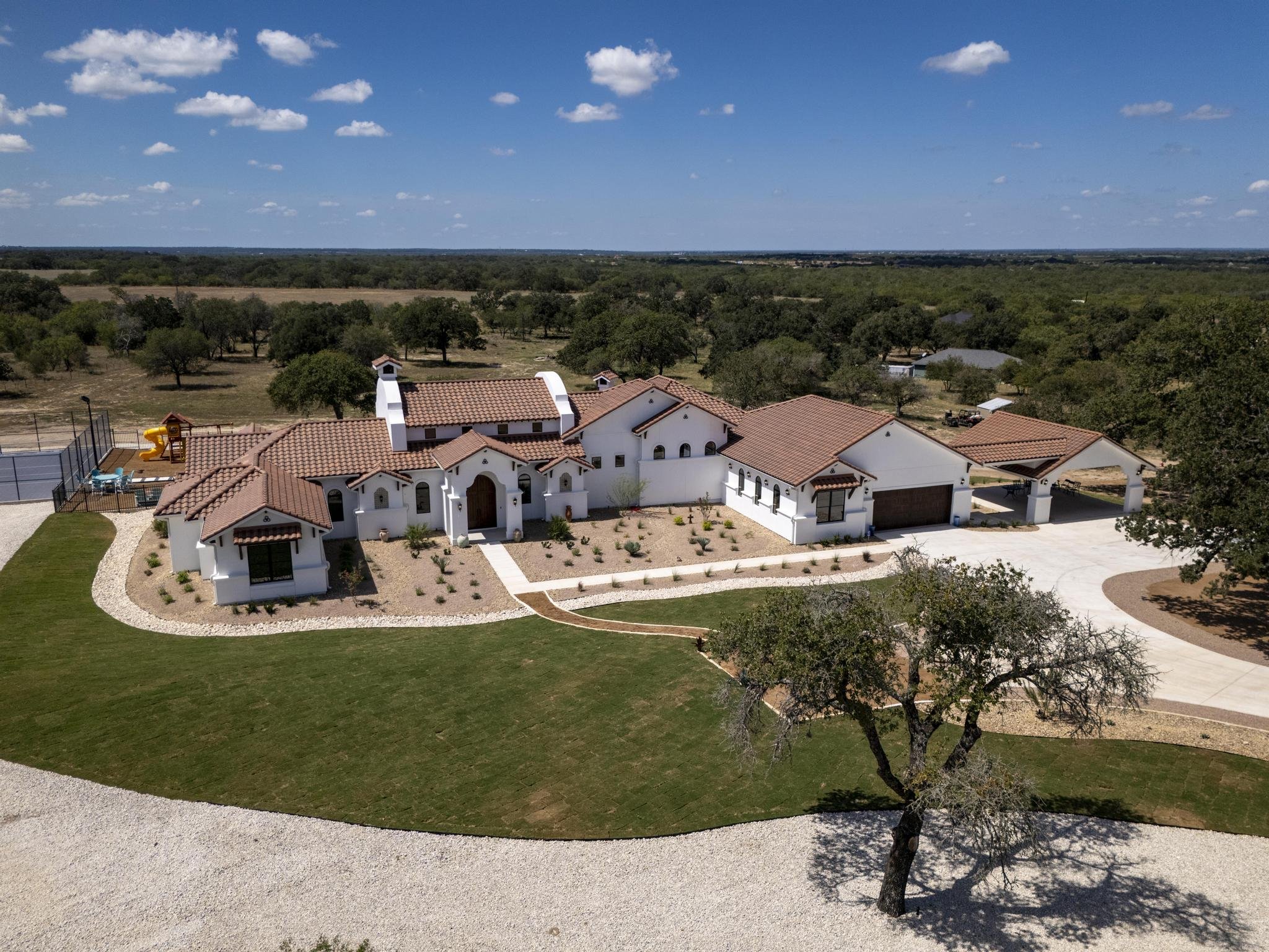 An aerial view of a Marquis Builders custom home in the Texas Hill Country