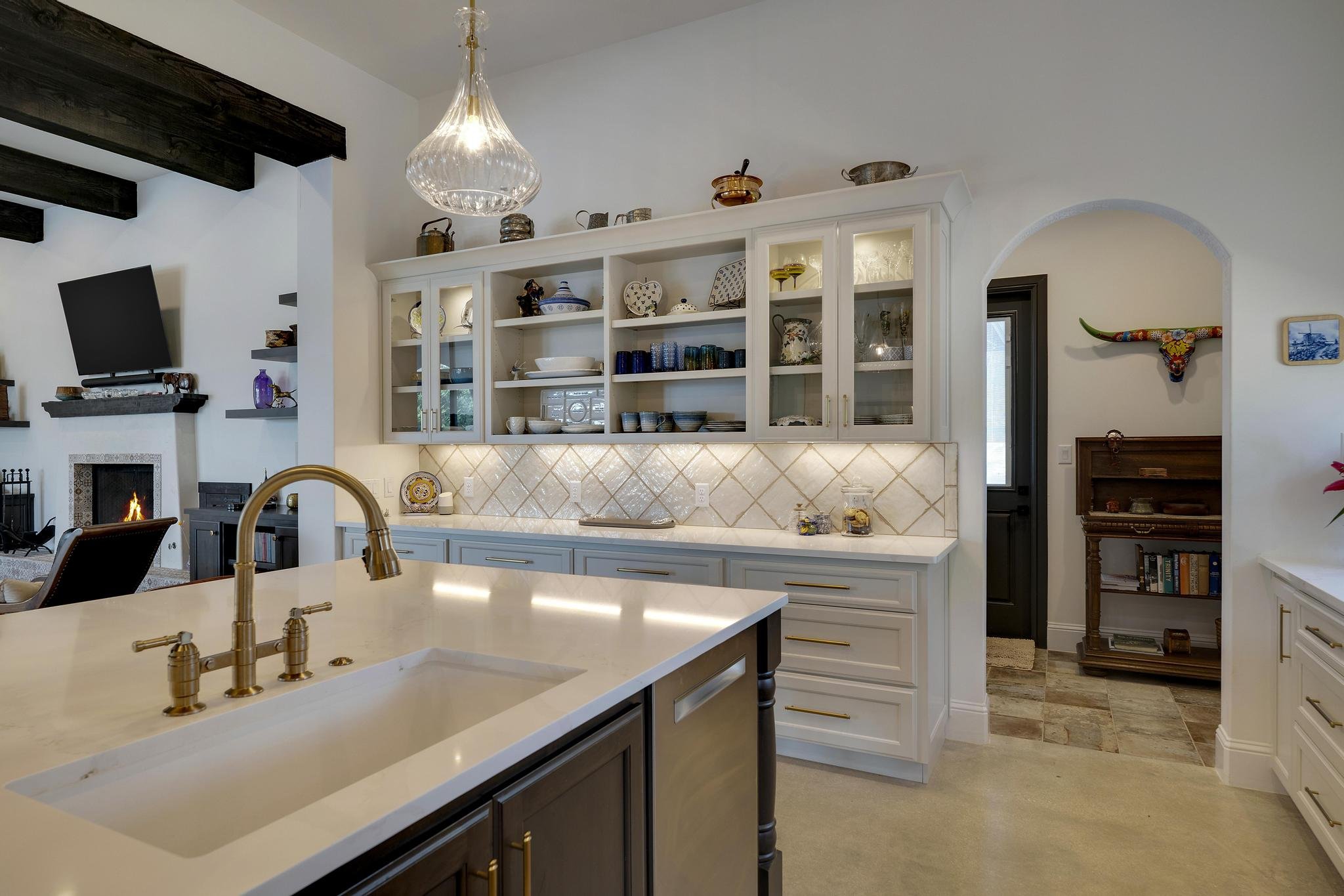 Whole-home remodel by Marquis Builders, kitchen and great room