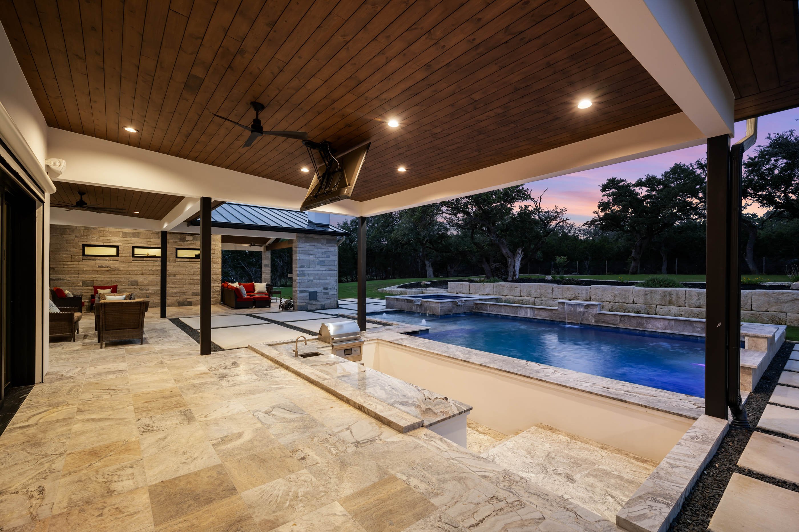 Marquis Builders custom home at twilight, 60 Ranch Point