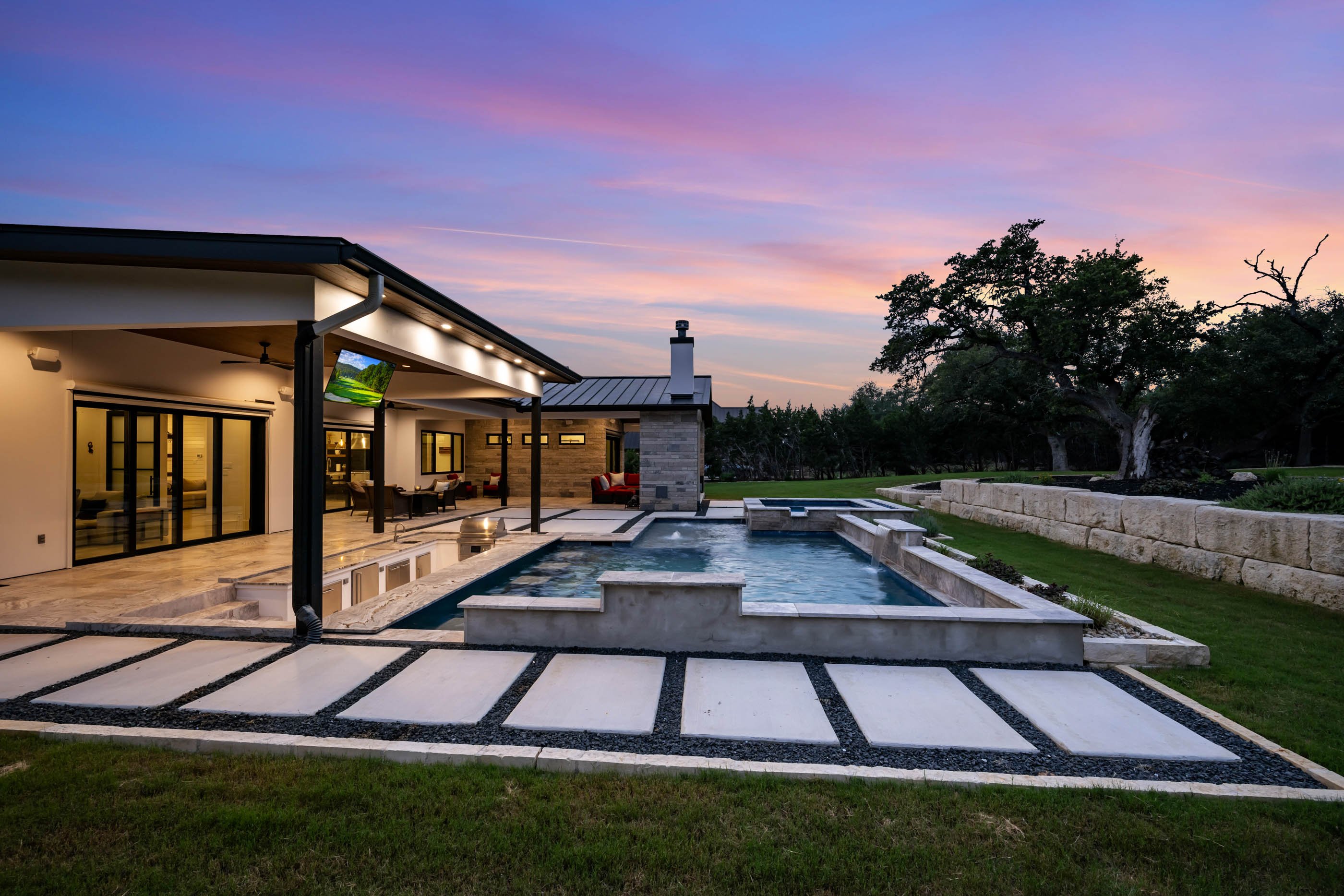 A Marquis Builders custom home at twilight, wide exterior