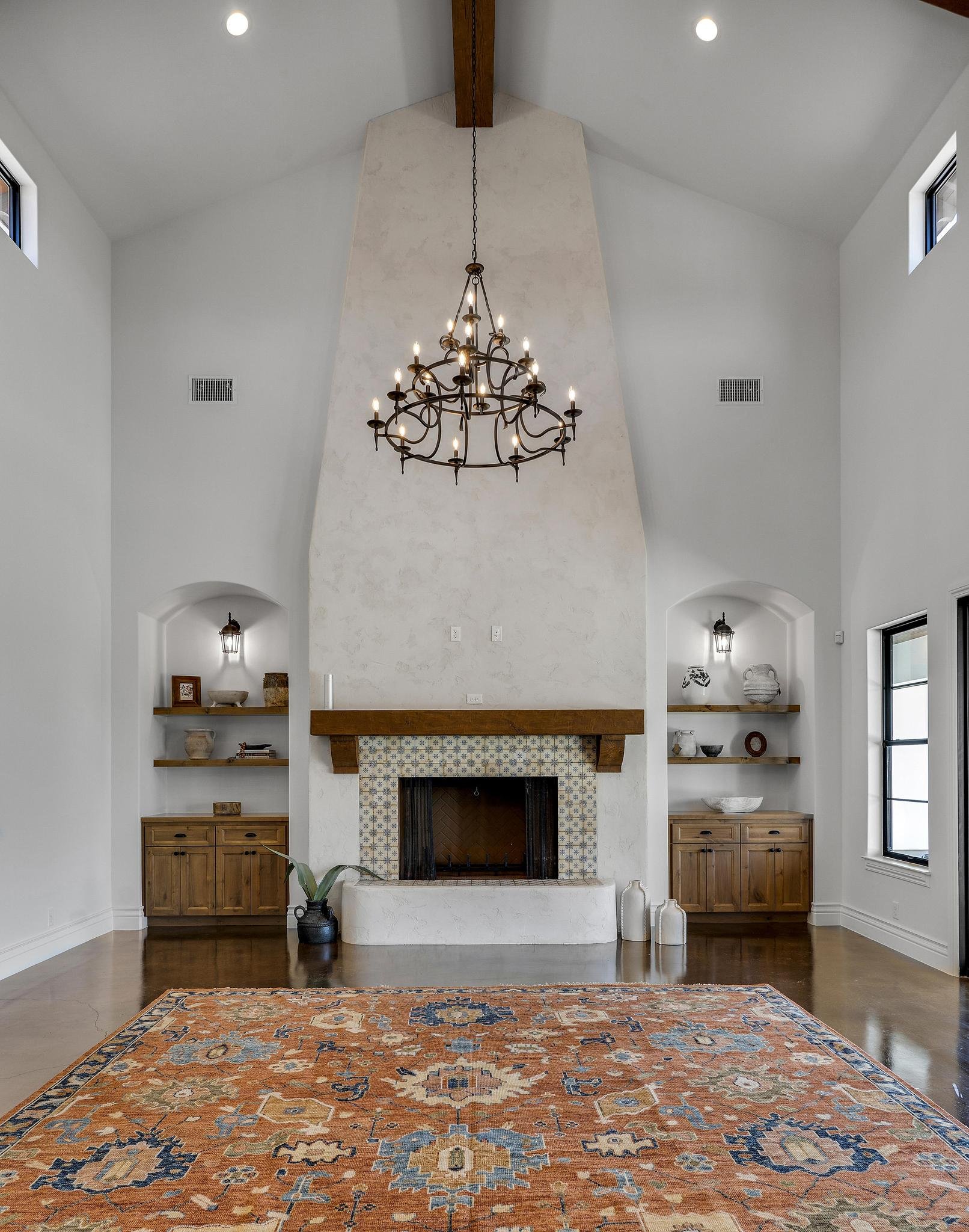 Great room with a beamed ceiling and chandelier in a Marquis Builders custom home