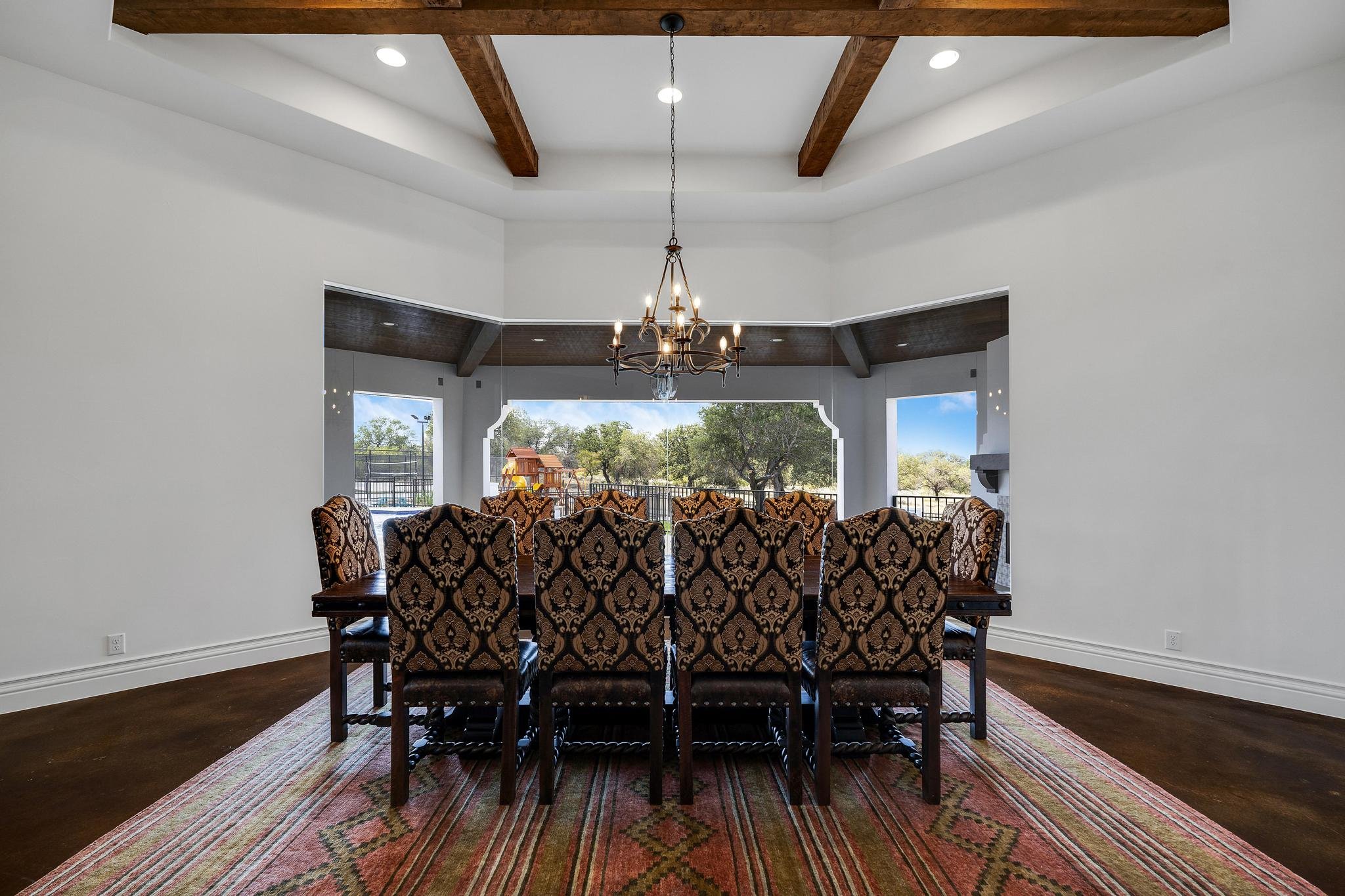 Dining room with a beamed ceiling in a Marquis Builders home