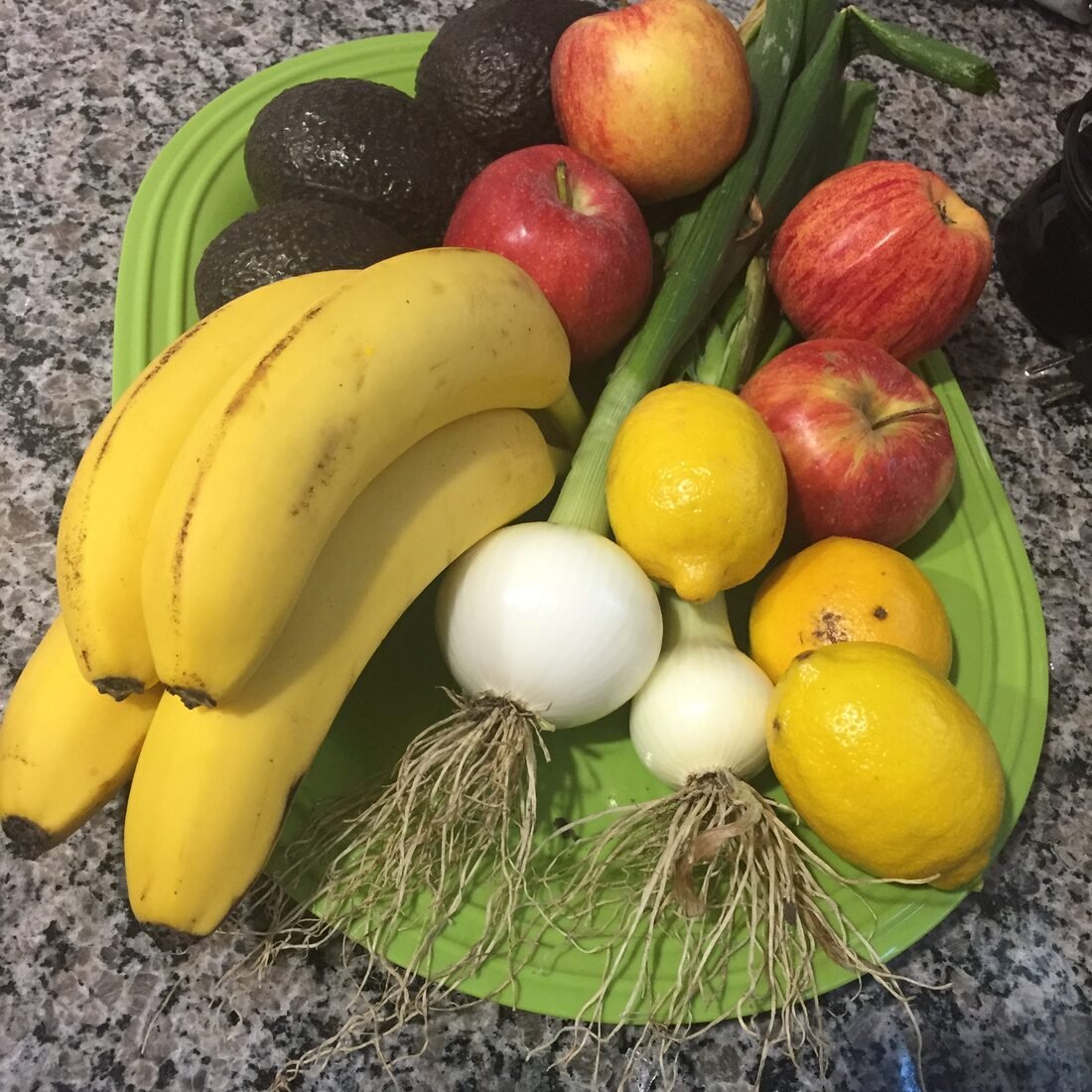 A colorful bowl of whole fruits and vegetables