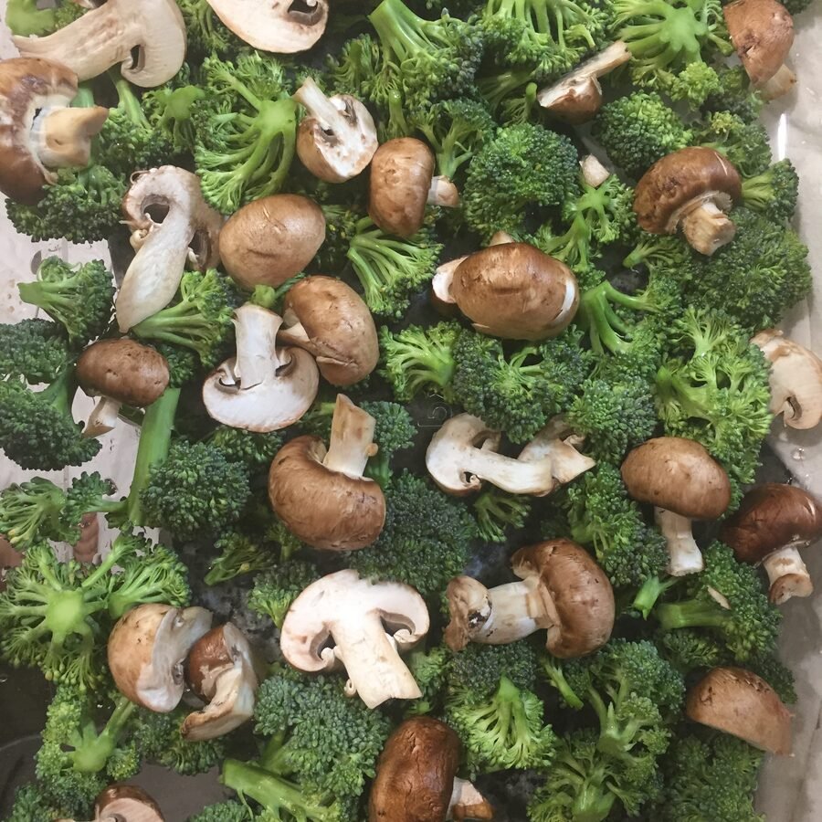 Fresh broccoli and mushrooms ready to cook